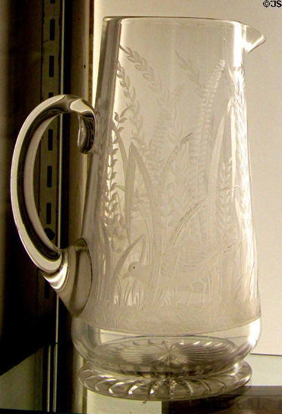 Engraved pitcher (c1887) by Joseph Henry Lapham of Boston & Sandwich Glass Co. at Sandwich Glass Museum. Sandwich, MA.