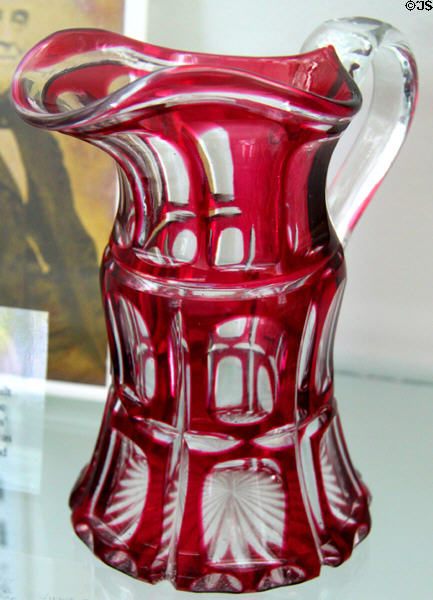 Cut overlay glass pitcher (c1863-73) by Boston & Sandwich Glass Co. at Sandwich Glass Museum. Sandwich, MA.