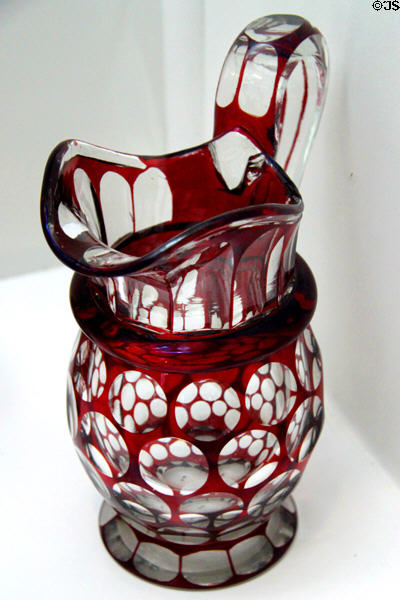 Cut overlay glass pitcher (c1860-70s) by Boston & Sandwich Glass Co. at Sandwich Glass Museum. Sandwich, MA.