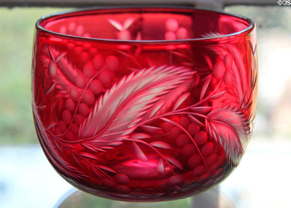 Engraved ruby cased bowl (1860-87) by Boston & Sandwich Glass Co. at Sandwich Glass Museum. Sandwich, MA.