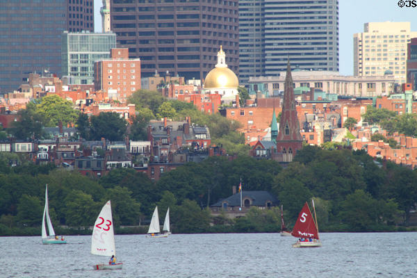 Gold-domed Statehouse, Beacon Hill over Charles River Basin. Boston, MA.