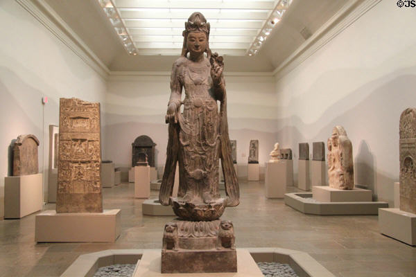 Asian gallery at Museum of Fine Arts with stone Bodhisattva of compassion (c580) from China. Boston, MA.
