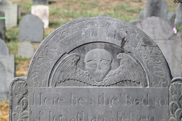 Tombstone with winged skull (1737) in Old Hill Burying Ground on Monument Sq. Concord, MA.