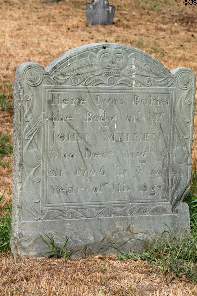Tombstone with winged skull (1727) in Old Hill Burying Ground on Monument Sq. Concord, MA.