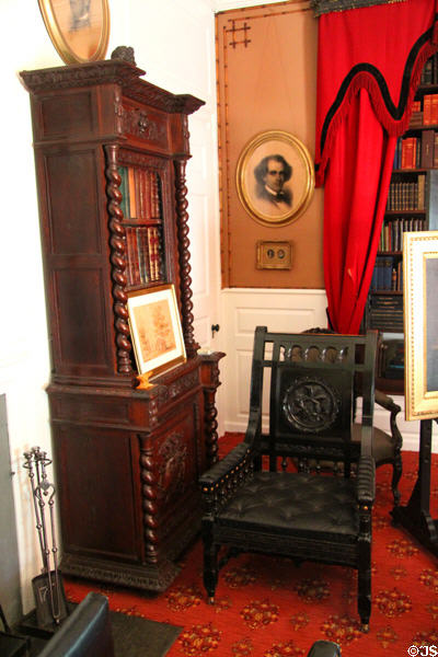 Longfellow's study with spreading chestnut tree armchair at Longfellow National Historic Site. Cambridge, MA.