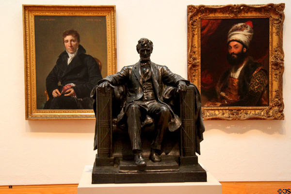 Bronze model of Abraham Lincoln (1916) by Daniel Chester French flanked by portrait paintings by Jacques-Louis David (1817) & Sir Thomas Lawrence (1810) at Harvard Art Museums. Cambridge, MA.