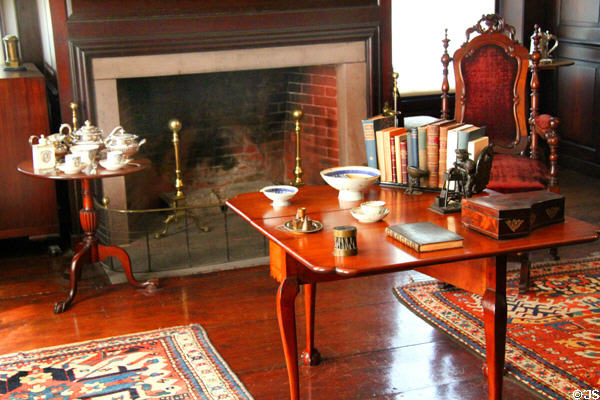 Fireplace, tea table & drop-leaf table in Paneled Room at Peacefield. Quincy, MA.