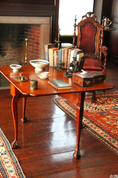 Drop-leaf table with books & China in Paneled Room at Peacefield. Quincy, MA.