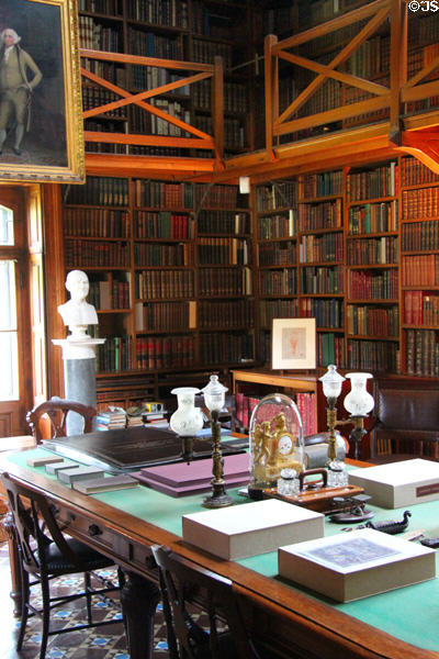 Interior of Stone Library at Peacefield with central table. Quincy, MA.