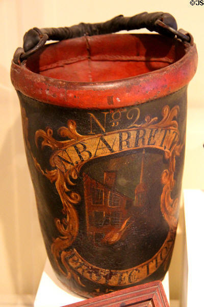 Leather fire bucket (early 19thC) painted N. Barrett / Protection at Concord Museum. Concord, MA.