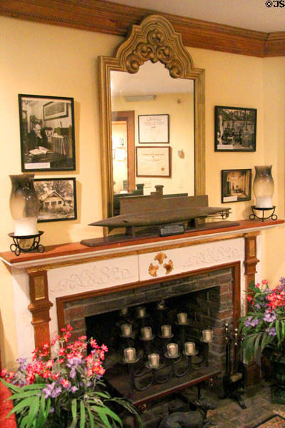 Fireplace with submarine model conveying work by John Hammond in designing guidance system for torpedoes & silent propeller for subs at Hammond Castle Museum. Gloucester, MA.