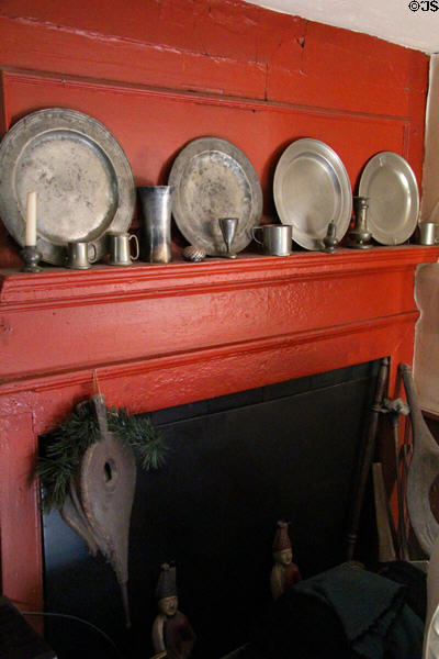 Fireplace with collection of pewter at John Balch Museum House. Beverly, MA.