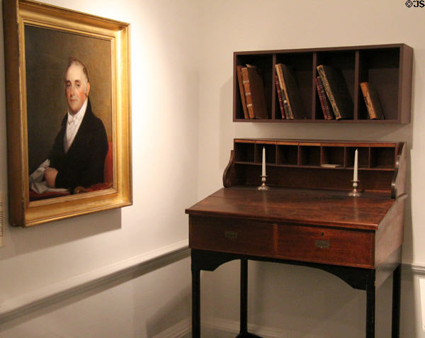 Bankers' writing desk (early-mid 19thC) beside portrait of Israel Thorndike (1854) in Bank room at John Cabot House. Beverly, MA.