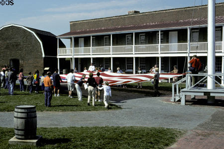 Visitors participate in flag ceremony run by National Park Service at Fort McHenry. Baltimore, MD.