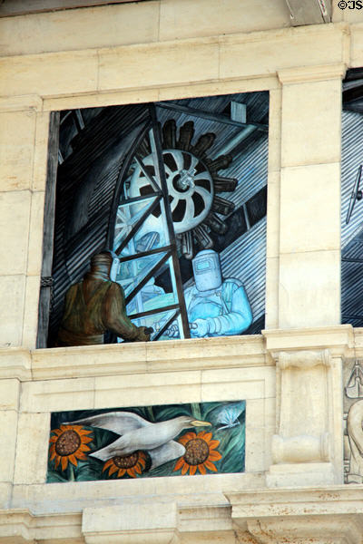 Welding Ford Trimotor aircraft over dove of peace on west wall of Detroit Industry Murals by Diego Rivera at Detroit Institute of Arts. Detroit, MI.