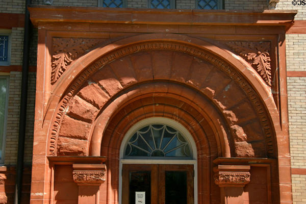 Red stone arch of Lenawee County Historical Museum. Adrian, MI.