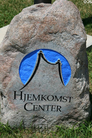 Hjemkomst Interpretive Center logo carved in stone. Moorhead, MN.