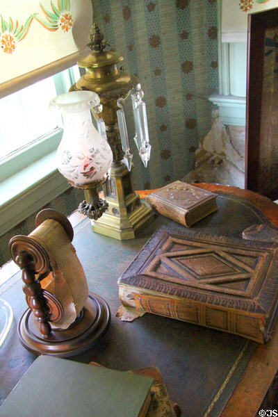 Oil lamp & reading material in study at Chatillon-DeMenil Mansion. St. Louis, MO.