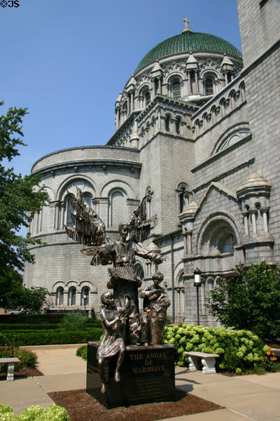Angel of Harmony sculpture (1999) by Wiktor Szostalo & side facade of Saint Louis Cathedral. St Louis, MO.
