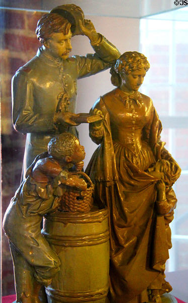 Taking Oath & Drawing Rations plaster sculpture (1865) by John Rogers show woman taking oath of loyalty to Union to receive food for children at 1859 Jail Museum. Independence, MO.