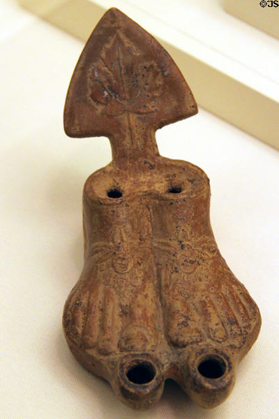 Terracotta lamp in shape of sandaled feet (1stC CE) at University of Missouri Museum of Art & Archaeology. Columbia, MO.