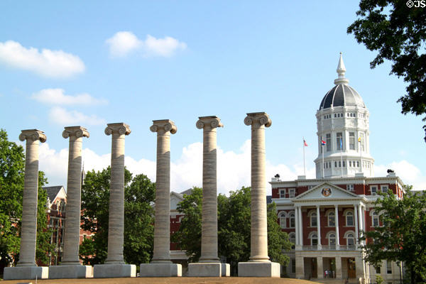 Column ruins of Academic Hall with Jesse Hall (1895) on quad of University of Missouri. Columbia, MO.
