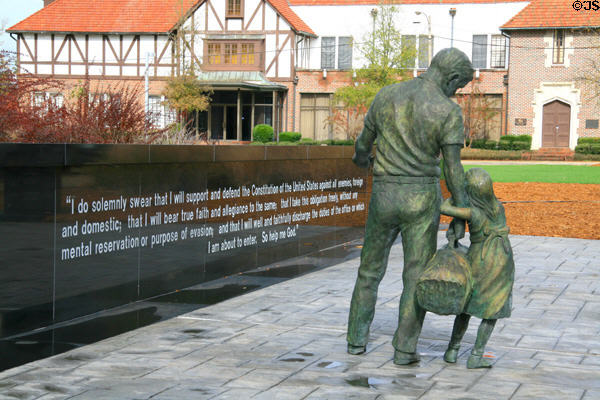 Sculpture of soldier with young girl of Flag Wall Veteran's Memorial at Woolfolk State Office Building. Jackson, MS.