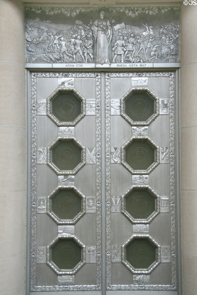 Cast aluminum doors with scenes from Battles of Ackia 1736 & Buena Vista 1847 at War Memorial Building. Jackson, MS. Style: Art Deco.
