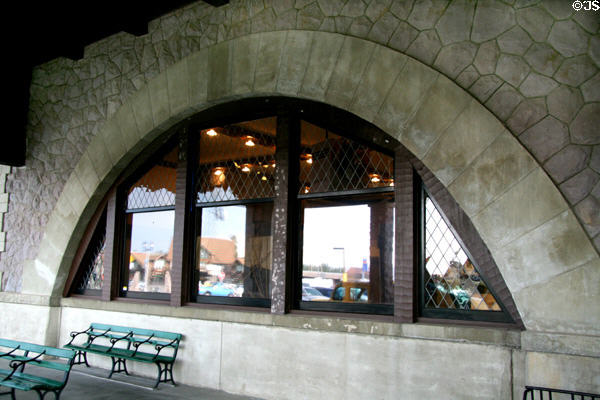 Arched window of rhyolite volcanic stones on West Yellowstone Union Pacific Depot. West Yellowstone, MT.