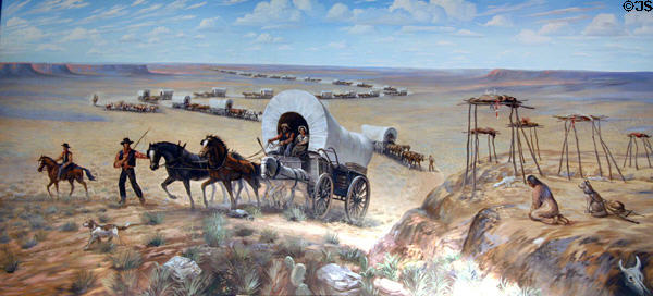 Mural of settlers in prairie wagons displacing Indians by Sidney King at Aurora Plainsman Museum. Aurora, NE.