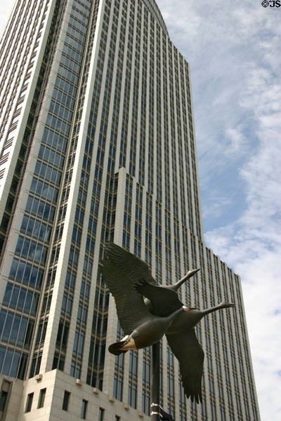 Sculpted Canada geese fly past facade of One First National Center. Omaha, NE.