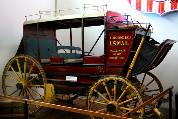 Wells Fargo open sided coach & US Mail wagon at Durham Western Heritage Museum. Omaha, NE.