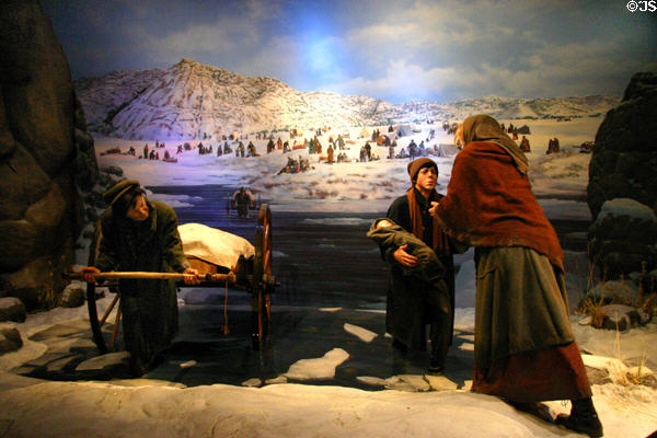 Diorama of Mormon push cart settlers being rescued from winter snows at Kearney Arch. Kearney, NE.