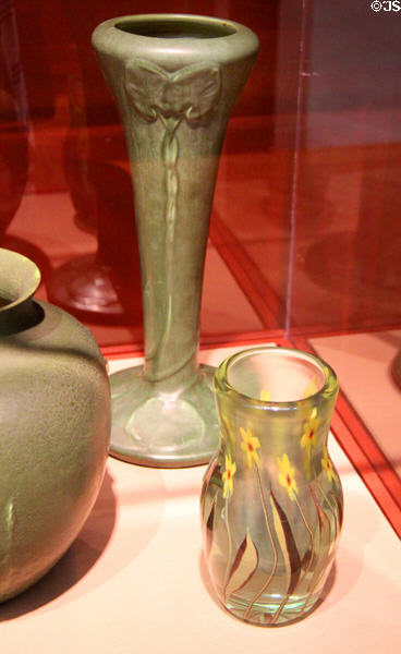 Stoneware vase (c1910) by Hampshire Pottery & paperweight vase (c1910) by Tiffany Furnaces of Corona, NY at Currier Museum of Art. Manchester, NH.