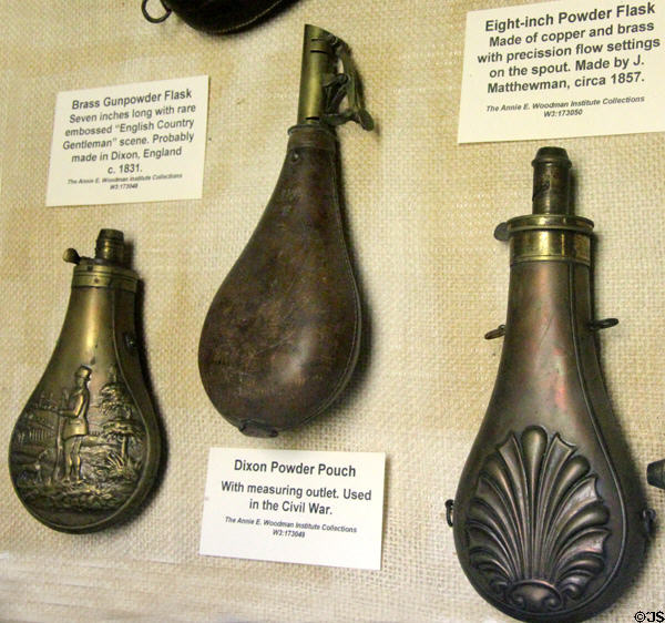 Three metal powder horns (c1831, 1860s, & 1857) at Woodman Museum. Dover, NH.