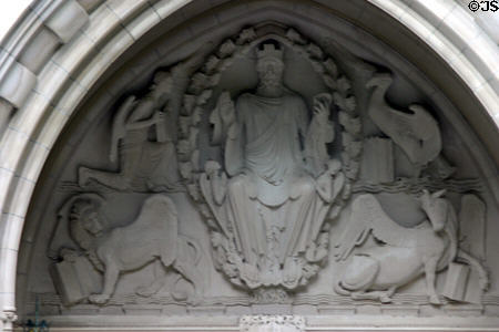 Relief of Christ plus symbols of Evangelists Matthew, Mark, Luke & John over portal of University Chapel. Princeton, NJ.