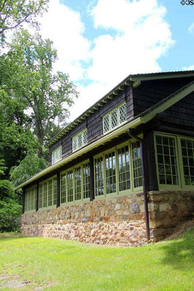 Enclosed porch overlooking garden at Gustav Stickley House Museum at Craftsman Farms. Morris Plains, NJ.