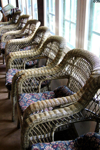 Woven willow craftsman armchairs on sun porch at Stickley Museum at Craftsman Farms. Morris Plains, NJ.