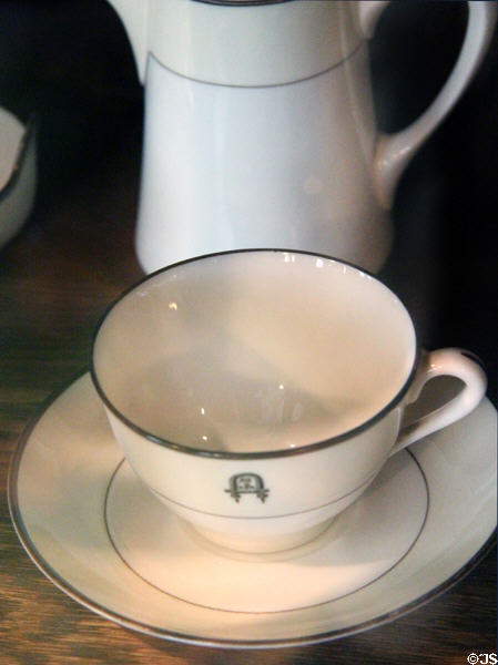 Stickley family porcelain cup & saucer (c1913) with Als Ik Kan crest at Stickley Museum at Craftsman Farms. Morris Plains, NJ.