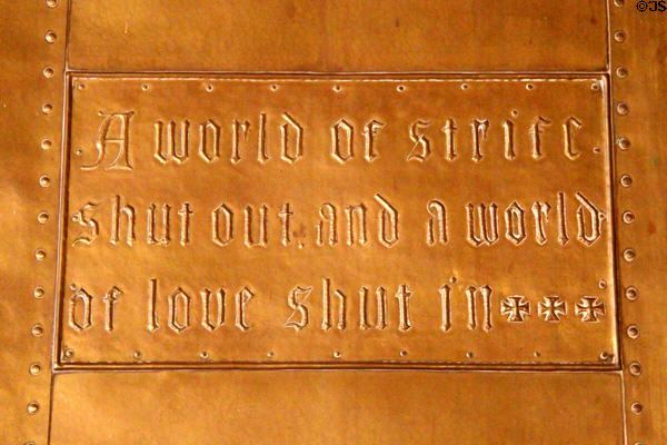 Fireplace copper repousse slogan 'A world of strife shut out and a world of love shut in' at Craftsman Farms. Morris Plains, NJ.