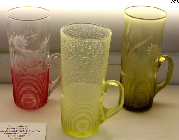 Glass lemonade or horn glasses with threading winding up from bottom (1880-87) by Boston & Sandwich Glass Co. at Museum of American Glass. Milville, NJ.