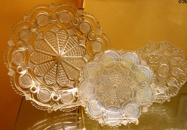New England pressed glass plates (c1830s) used lacy pattern to hide imperfections at Museum of American Glass. Milville, NJ.