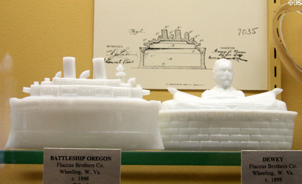 Pressed milk glass models of Battleship Oregon & Admiral Dewey on a fort both (c1898) by Flaccus Brothers Co. of Wheeling, WV related to Spanish American War at Museum of American Glass. Milville, NJ.