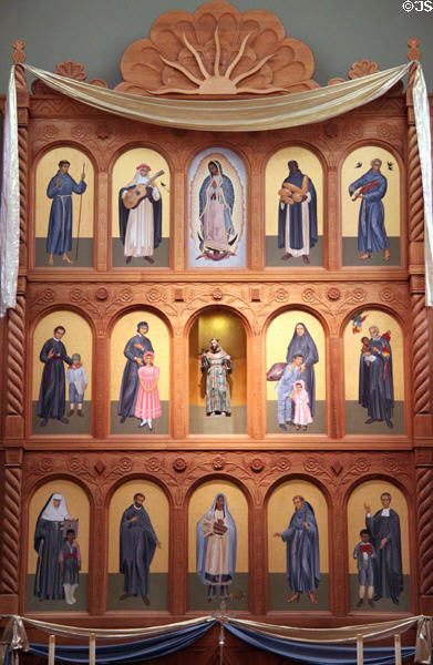 Reredos (1986) with St. Francis statue (1700s) surrounded by saints of the New World. Santa Fe, NM.