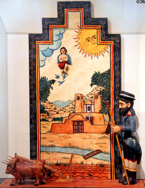 Santos de Nuevo Mexico painting with carving of San Ysidro, patron saint of farming, (1995-6) by Charlie Carrillo in NM State Capitol Art Collection. Santa Fe, NM.