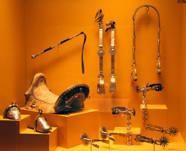 Silverwork (19thC) saddles, stirrups & spurs from South America at Museum of International Folk Art. Santa Fe, NM.