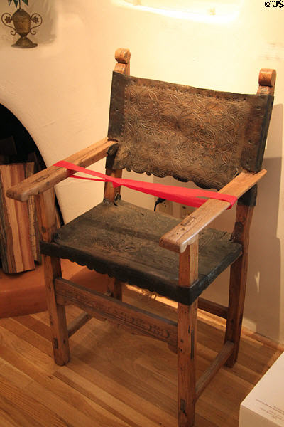 Armchair (18th C) from Peru of pine, leather & iron nails at Museum of Spanish Colonial Art. Santa Fe, NM.