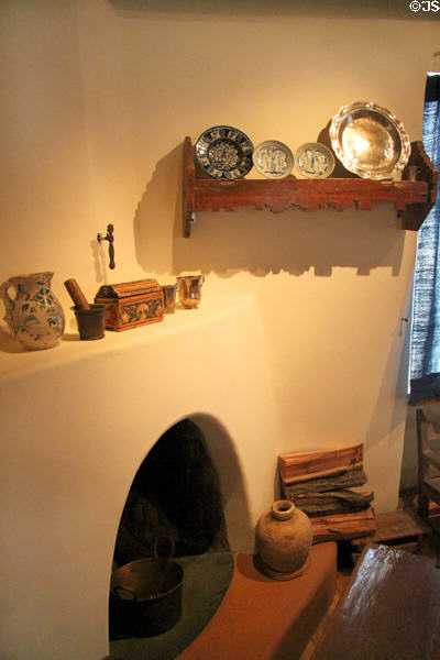 Collection of pottery on fireplace of Delgado home display at Museum of Spanish Colonial Art. Santa Fe, NM.