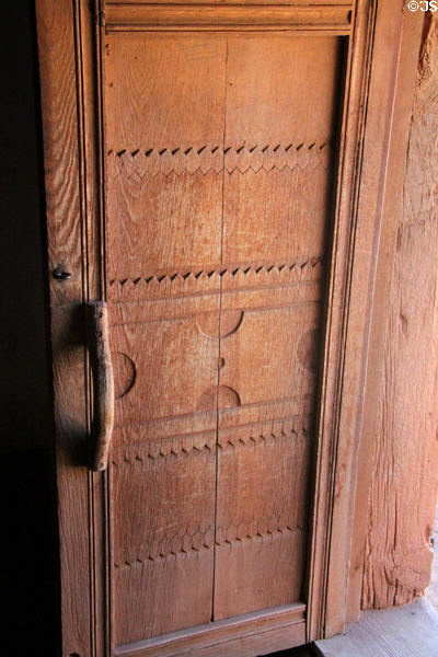 Decorated wooden door at Rancho de las Golondrinas. Santa Fe, NM.