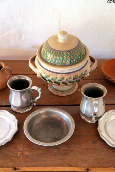 Covered pottery bowl plus pewter plates at Rancho de las Golondrinas. Santa Fe, NM.